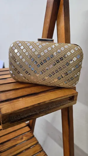 Golden fabric clutch bag